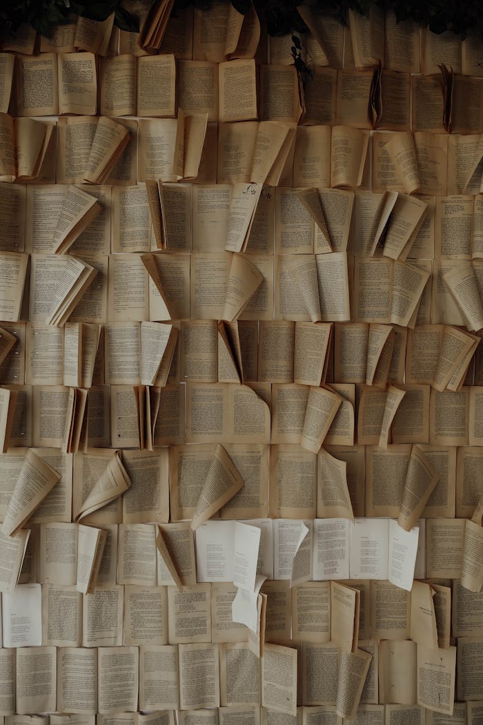 A captivating display of old open books arranged vertically, creating a vintage aesthetic.